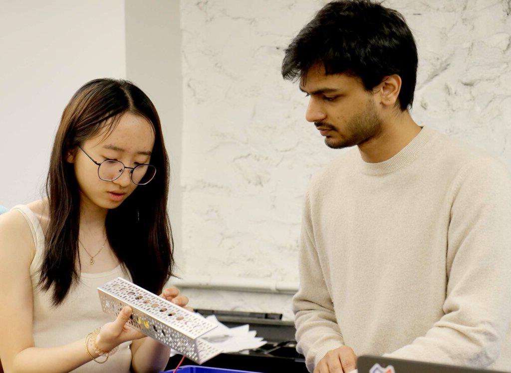 NYU grad student Pankaj Kalve with Tesvara Jiang ’23